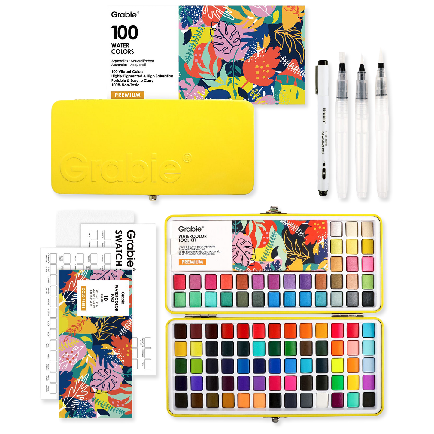 Grable watercolor set with watercolor pans, brushes, and swatch book on a white background