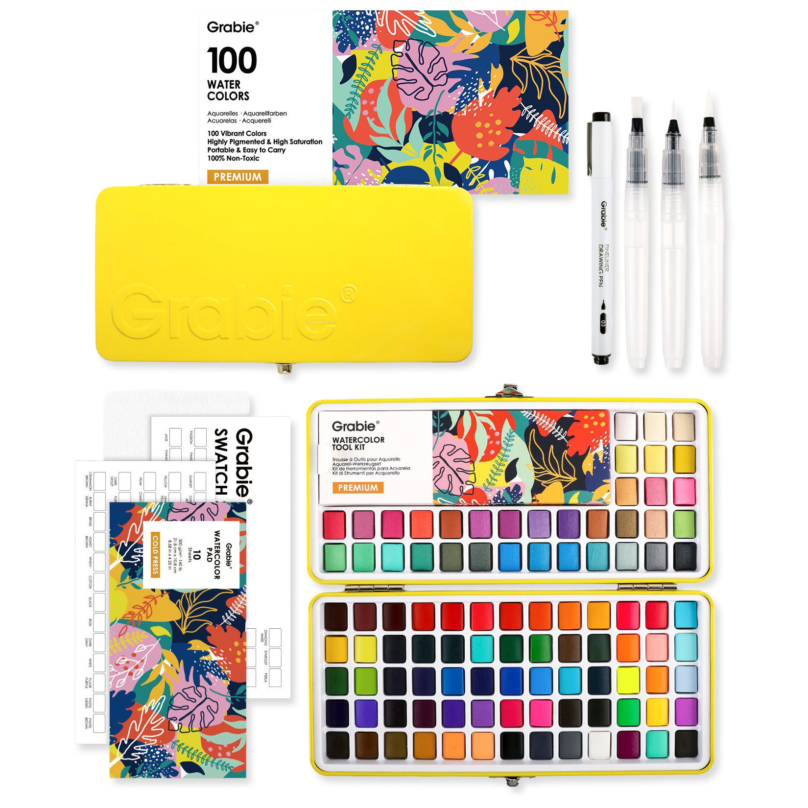 Grable watercolor set with watercolor pans, brushes, and swatch book on a white background