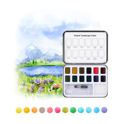 Watercolor paint set with landscape illustration and color swatches on a white background