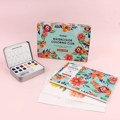 Watercolor coloring club set with watercolor pan set and paper on a pink background