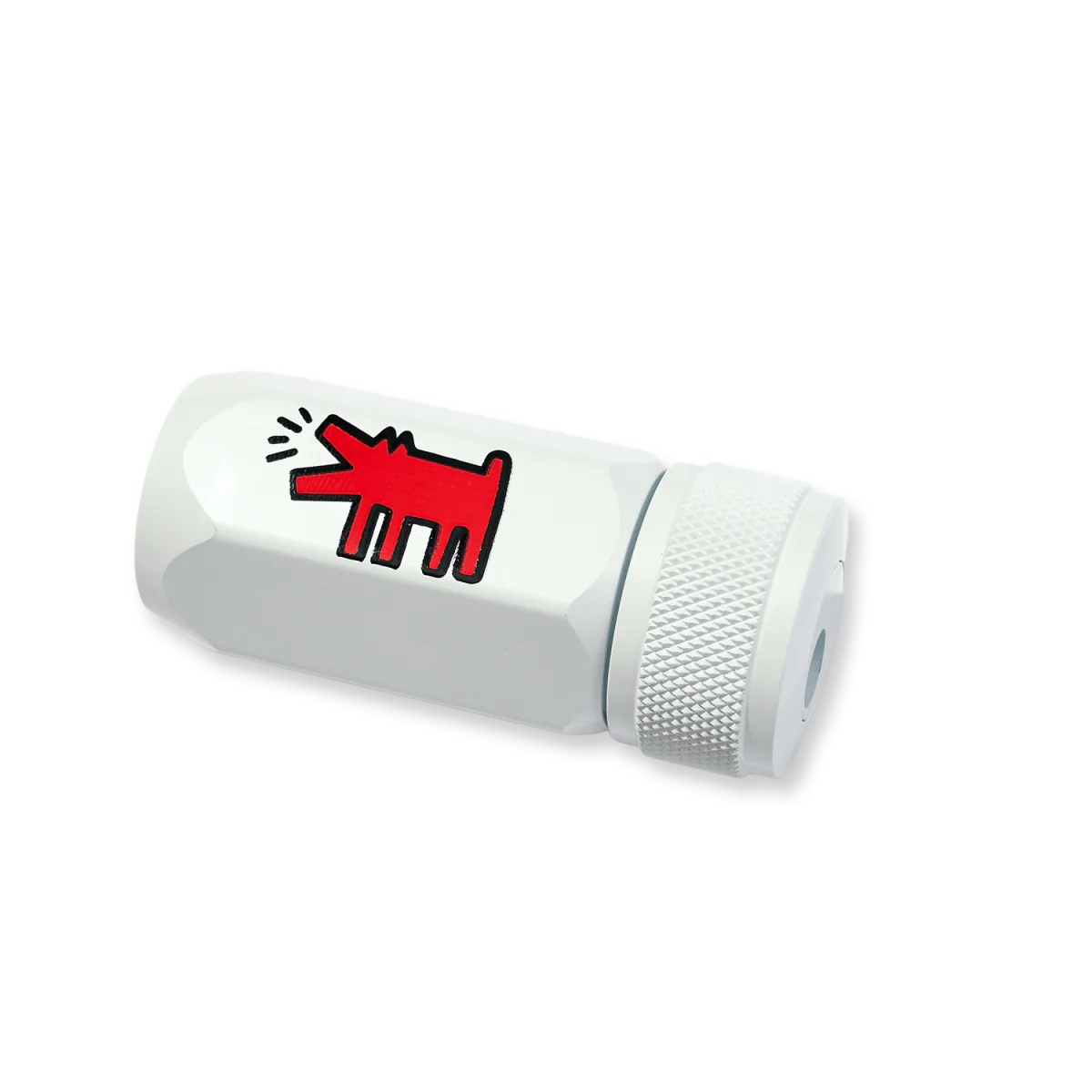 White cylindrical pencil sharpener with a red abstract design on a white background