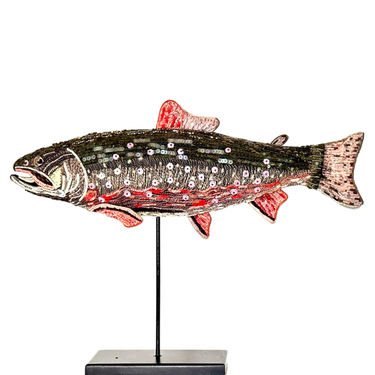 Decorative fish sculpture with sequins on a white background