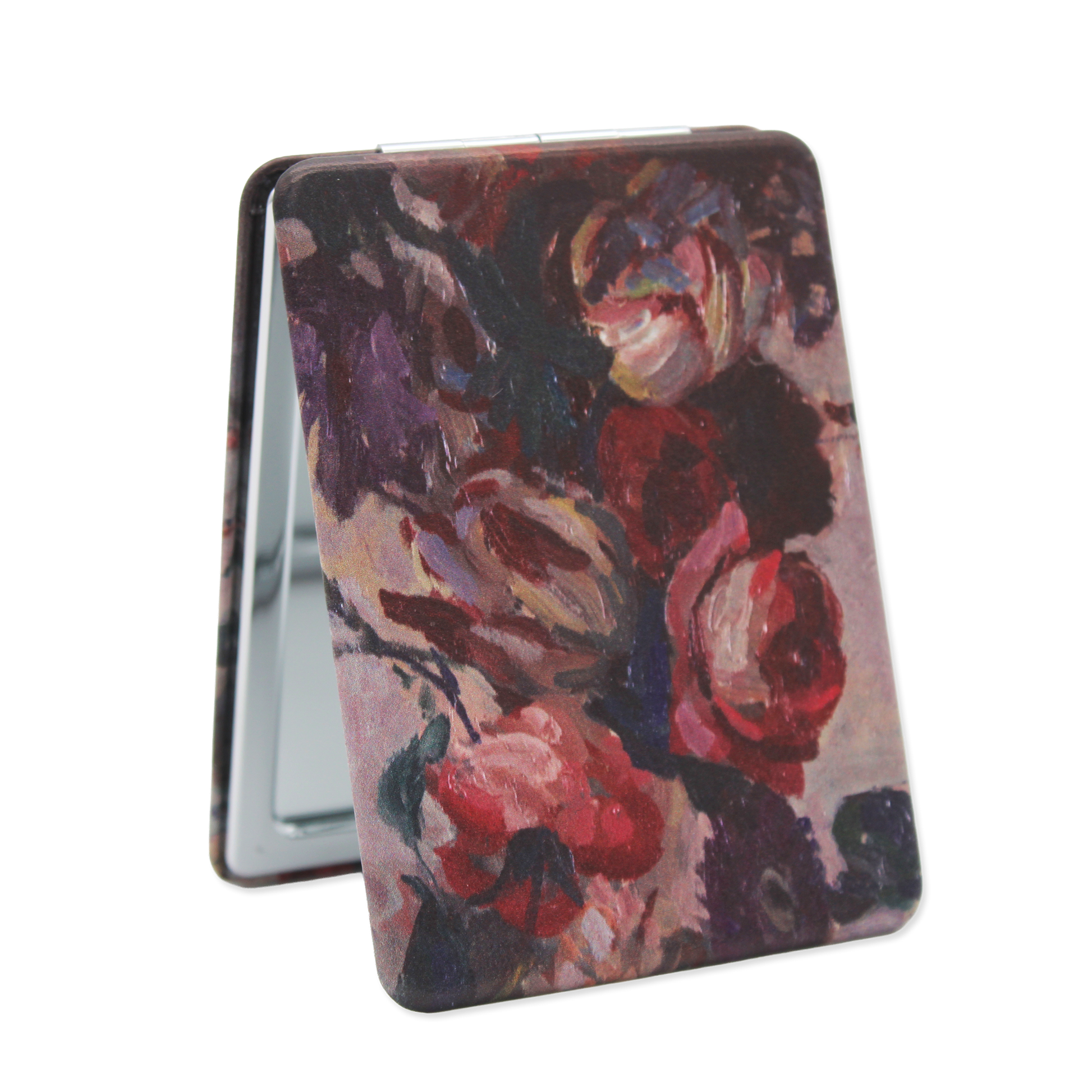 Floral patterned compact mirror on a white background