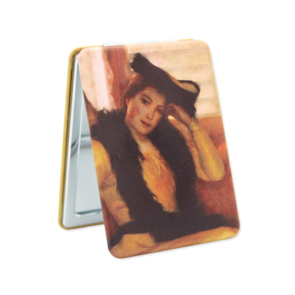 Compact mirror with a printed design of a woman wearing a hat on a white background
