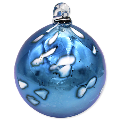 Blue glass ornament with white design