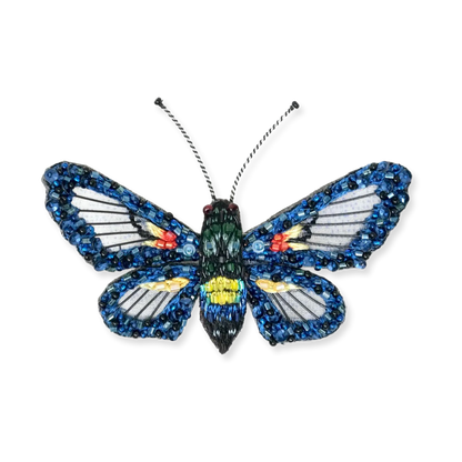 Butterfly-shaped object with blue and multicolored wings on a white background