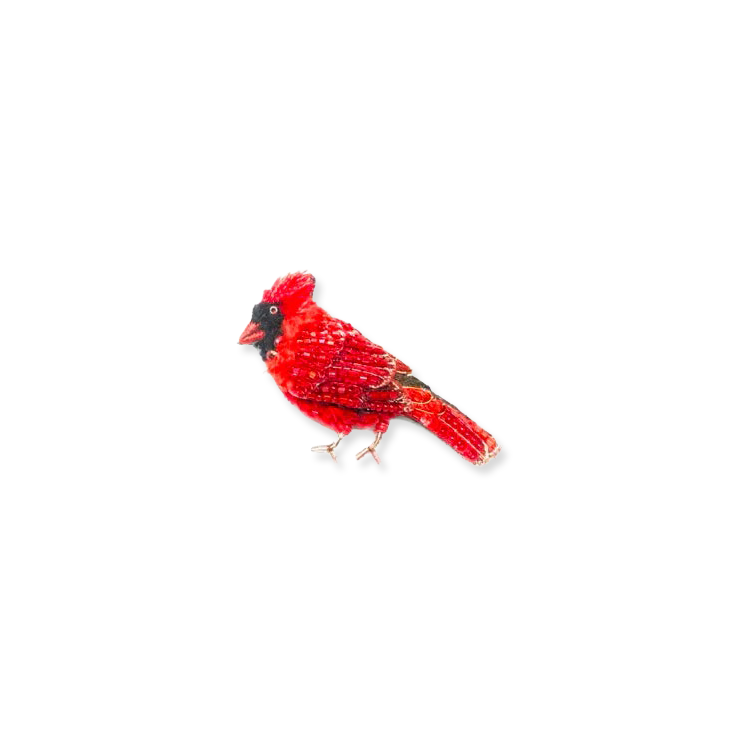 Red cardinal bird brooch on a white background