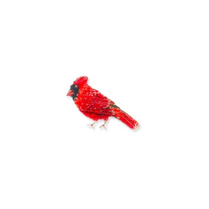 Red cardinal bird brooch on a white background