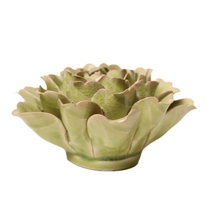 Green ceramic artichoke-shaped flower on a white background