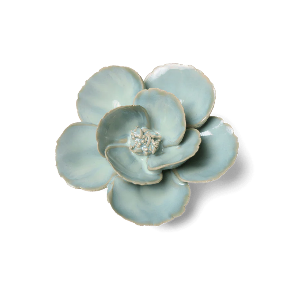 Ceramic flower-shaped dish on a white background