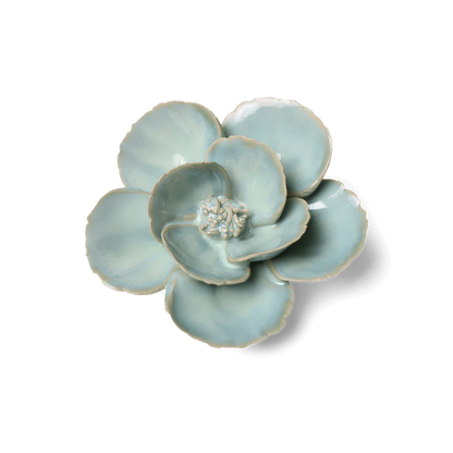 Ceramic flower-shaped dish on a white background