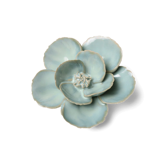 Ceramic flower-shaped dish on a white background