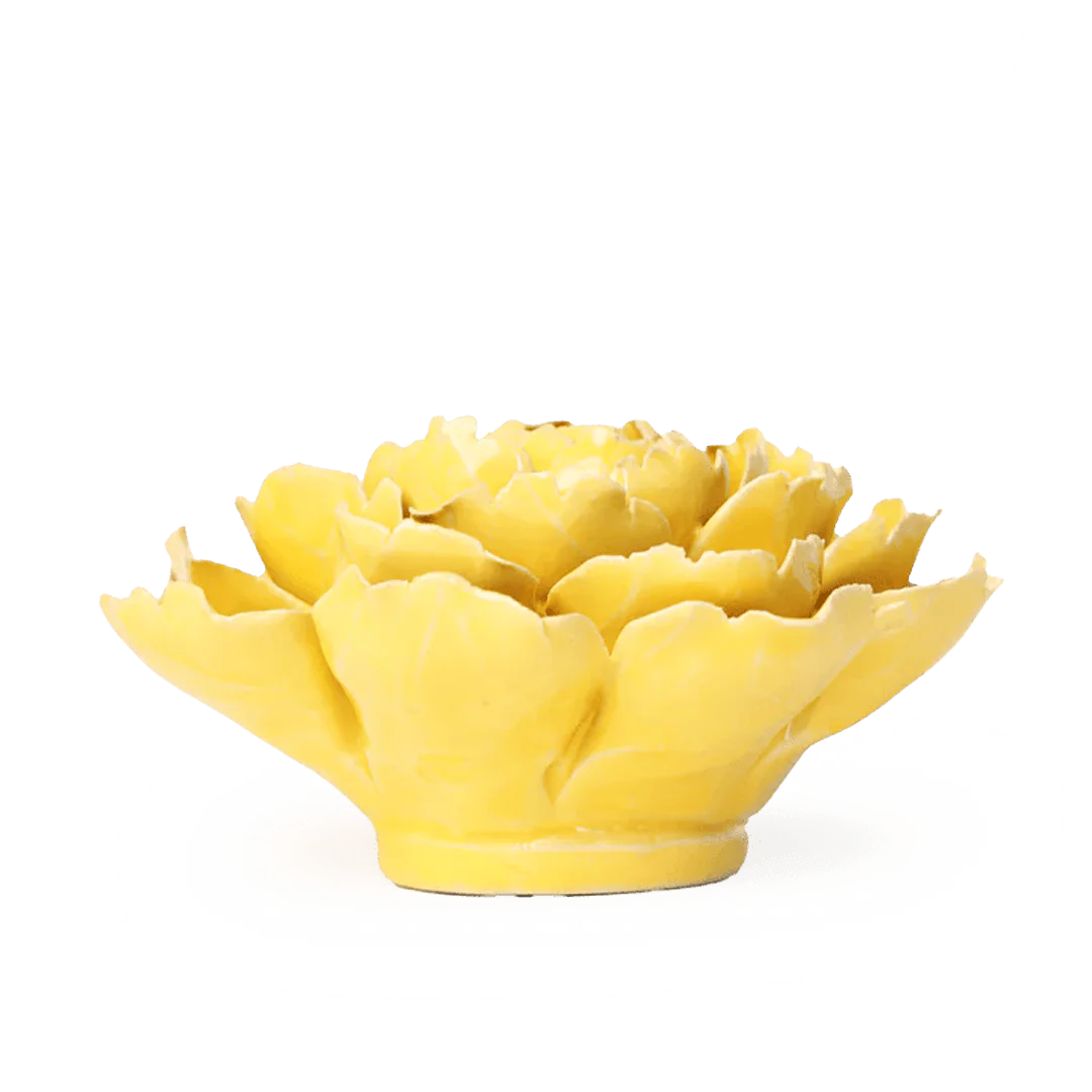 Yellow ceramic artichoke-shaped object on a white background