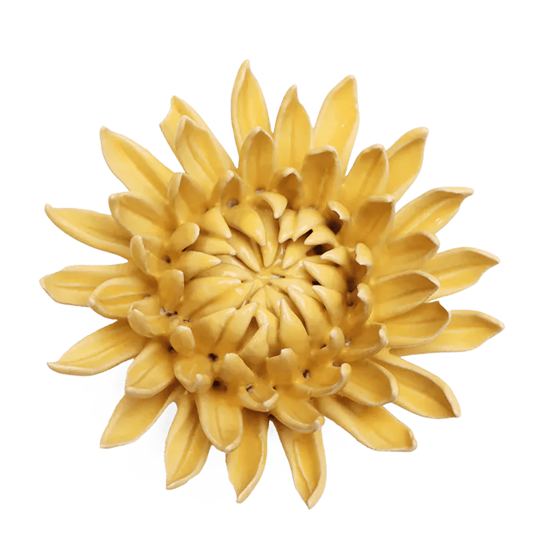 Yellow ceramic sunflower wall art on a white background