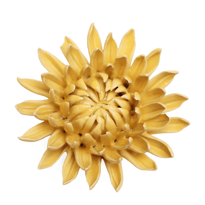 Yellow ceramic sunflower wall art on a white background