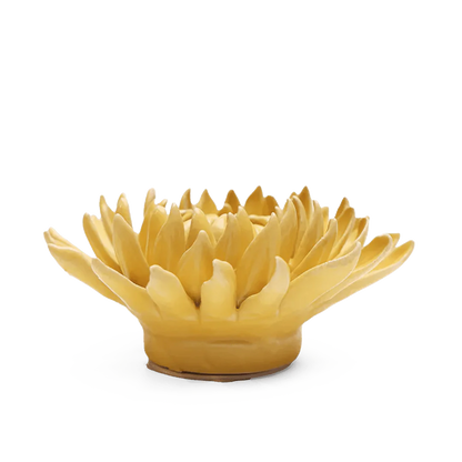 Yellow ceramic flower-shaped bowl on a white background