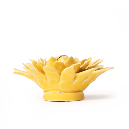 Yellow ceramic pineapple-shaped object on a white background
