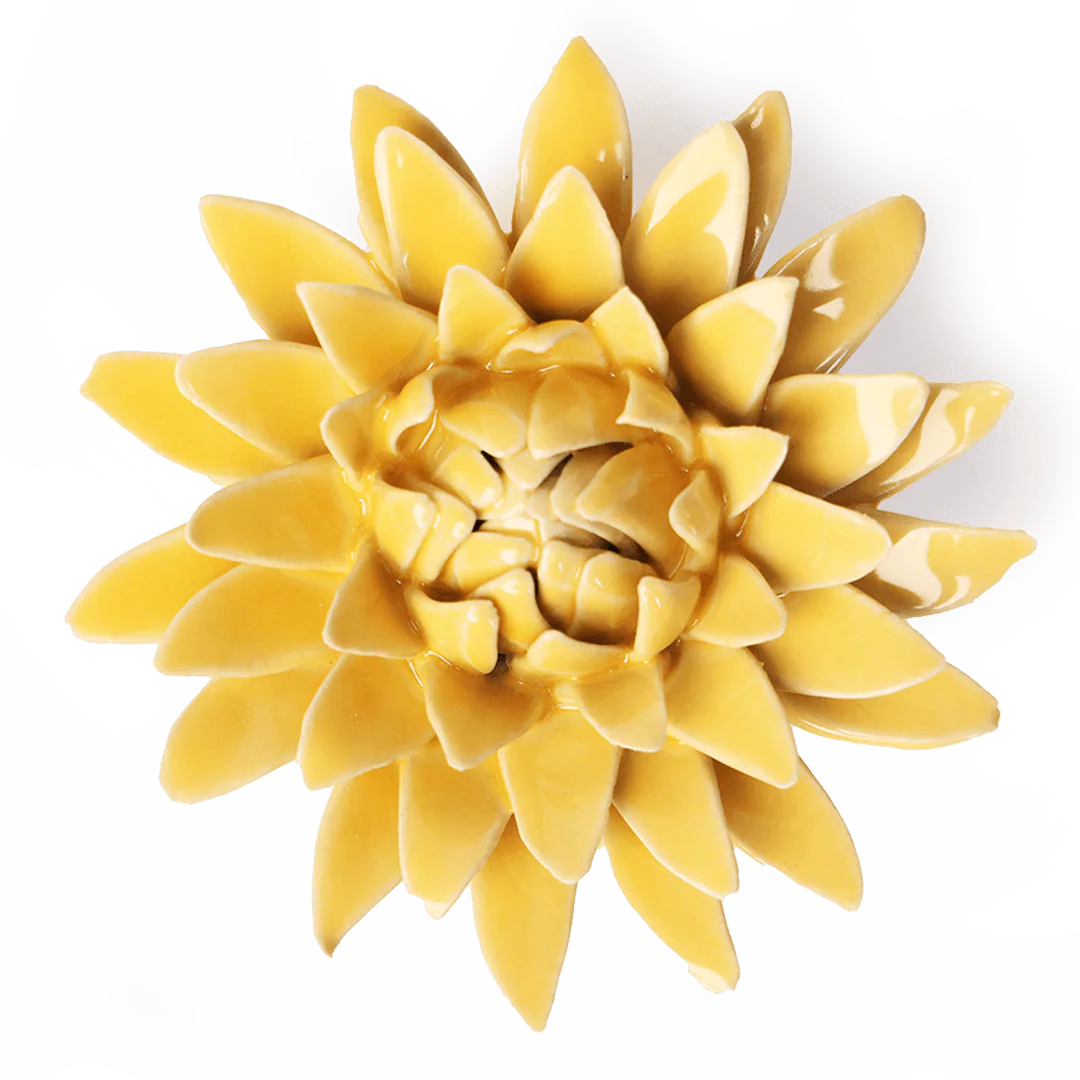 Yellow ceramic flower wall art on a white background