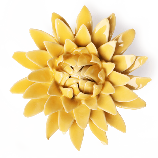 Yellow ceramic flower wall art on a white background
