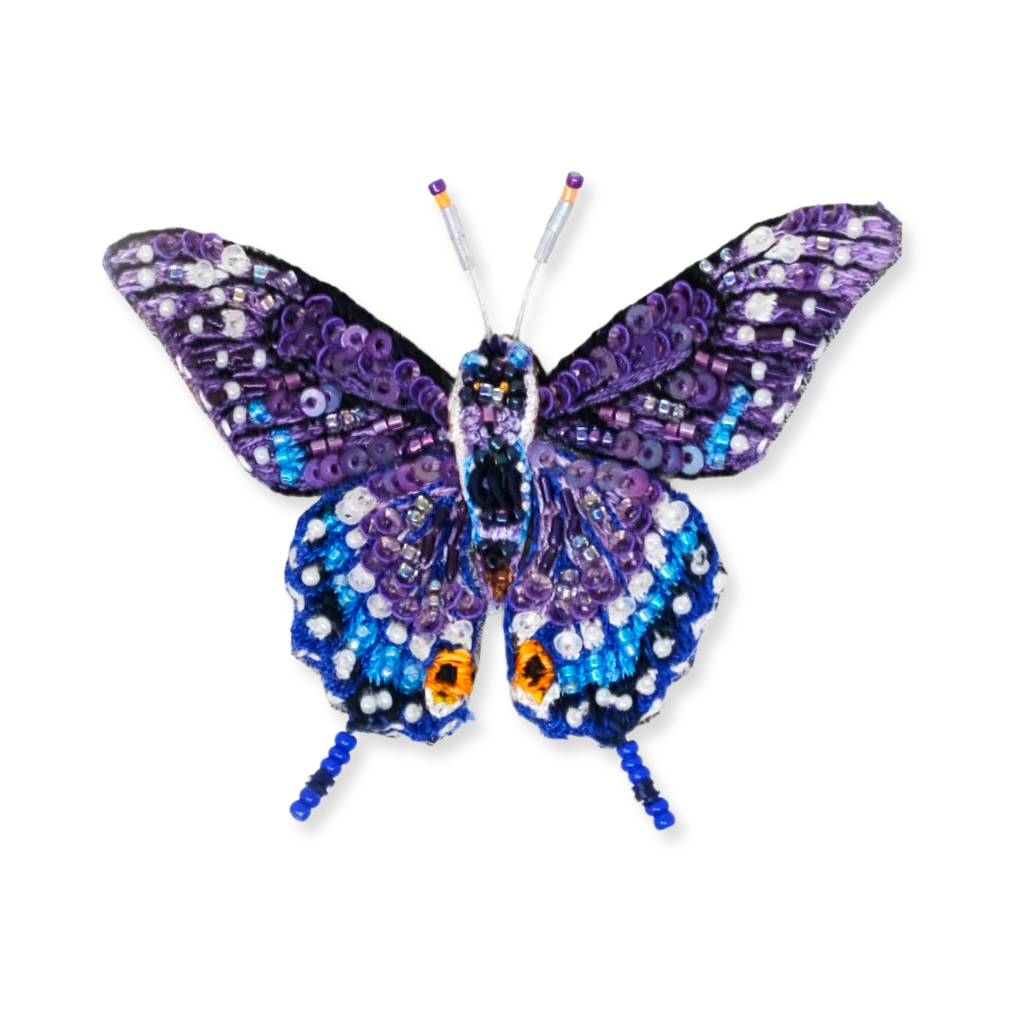 Decorative butterfly with purple and blue patterns on a white background