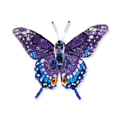 Decorative butterfly with purple and blue patterns on a white background
