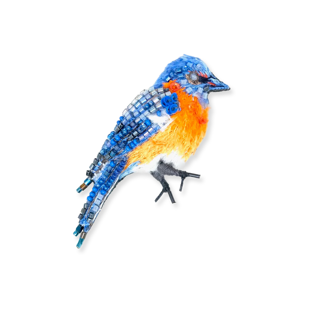 Decorative bird figurine with blue, orange, and gray colors on a white background