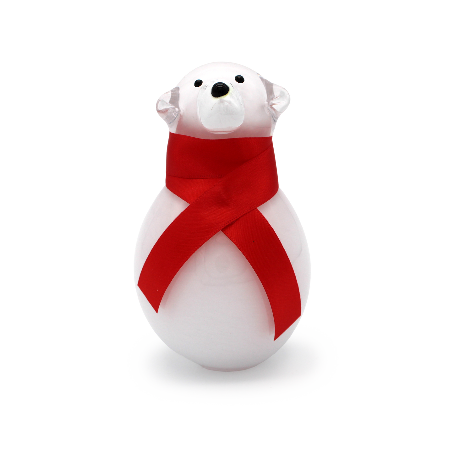 White polar bear figurine with a red ribbon on a white background