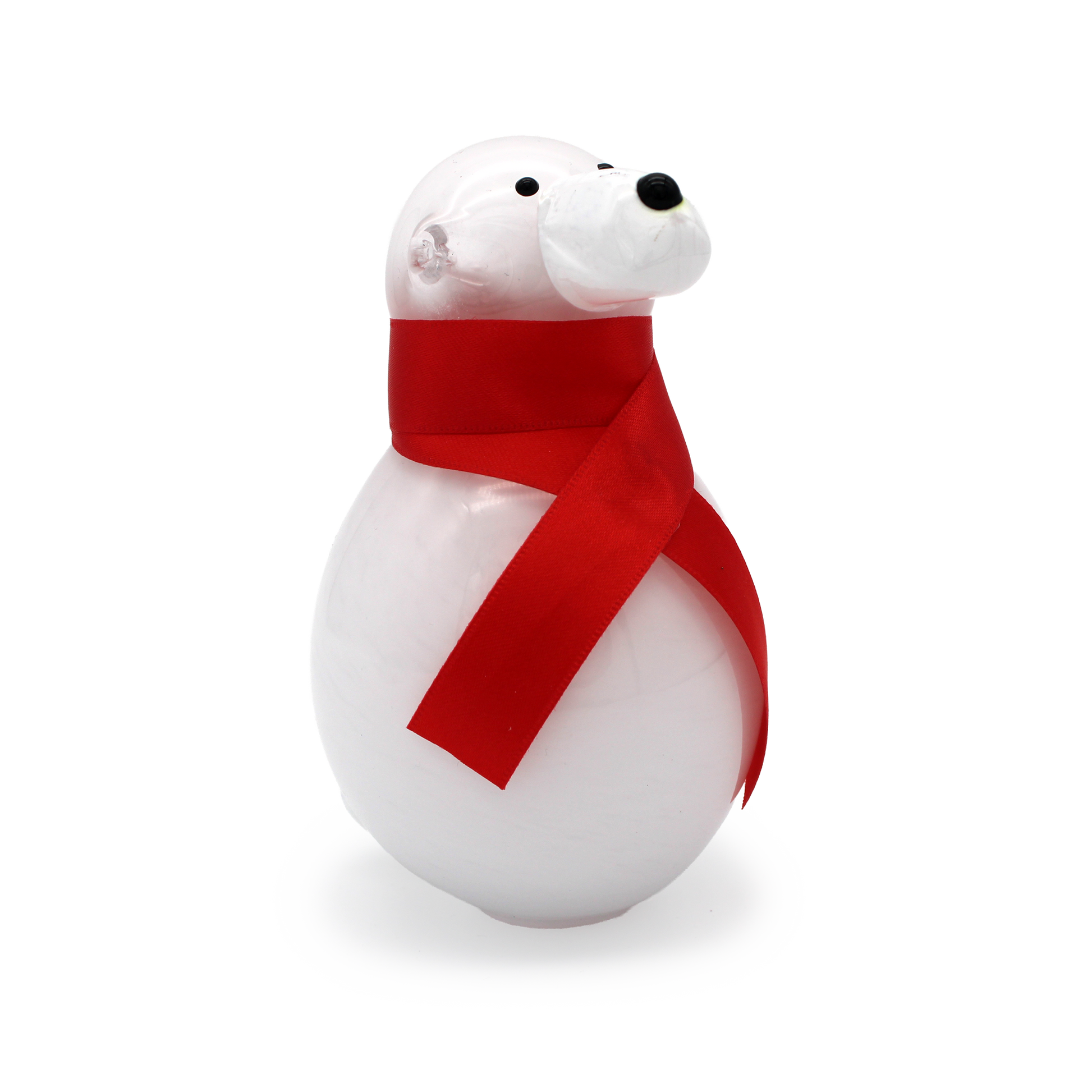 White polar bear figurine with a red ribbon on a white background