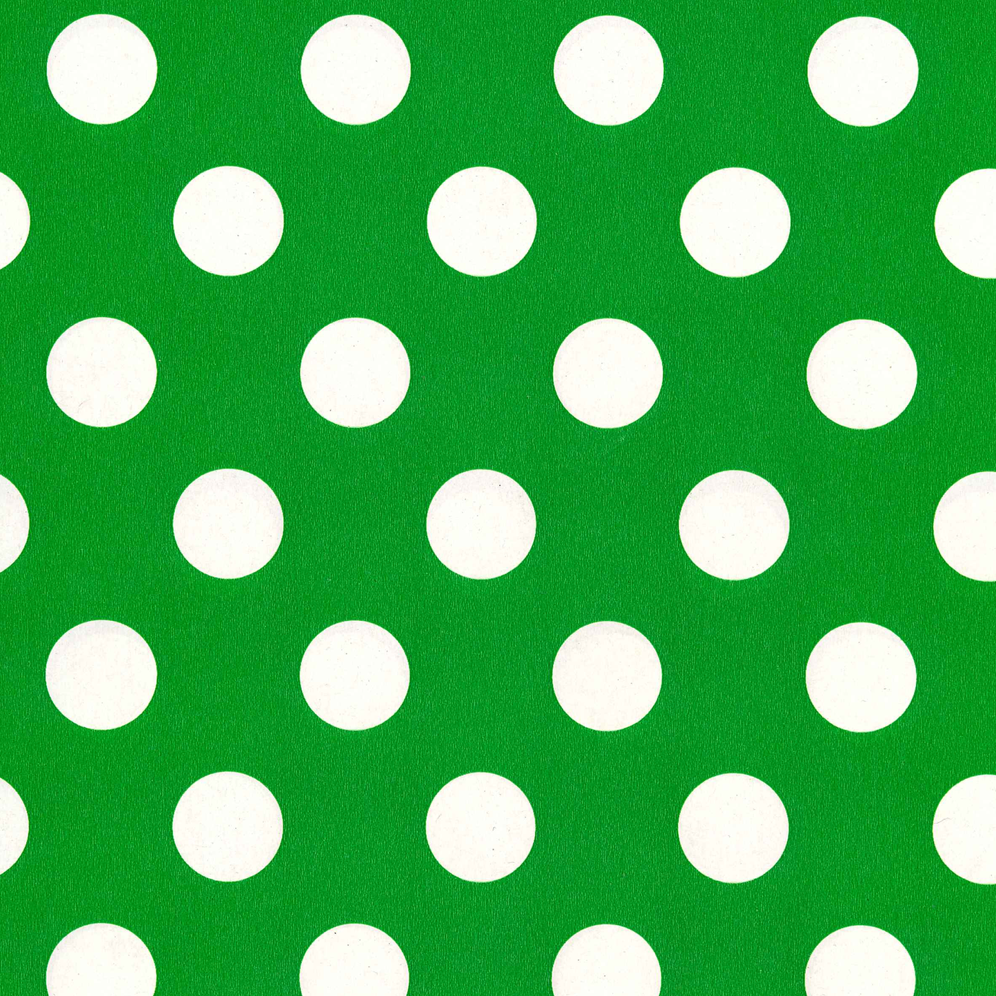 Green background with white polka dots
