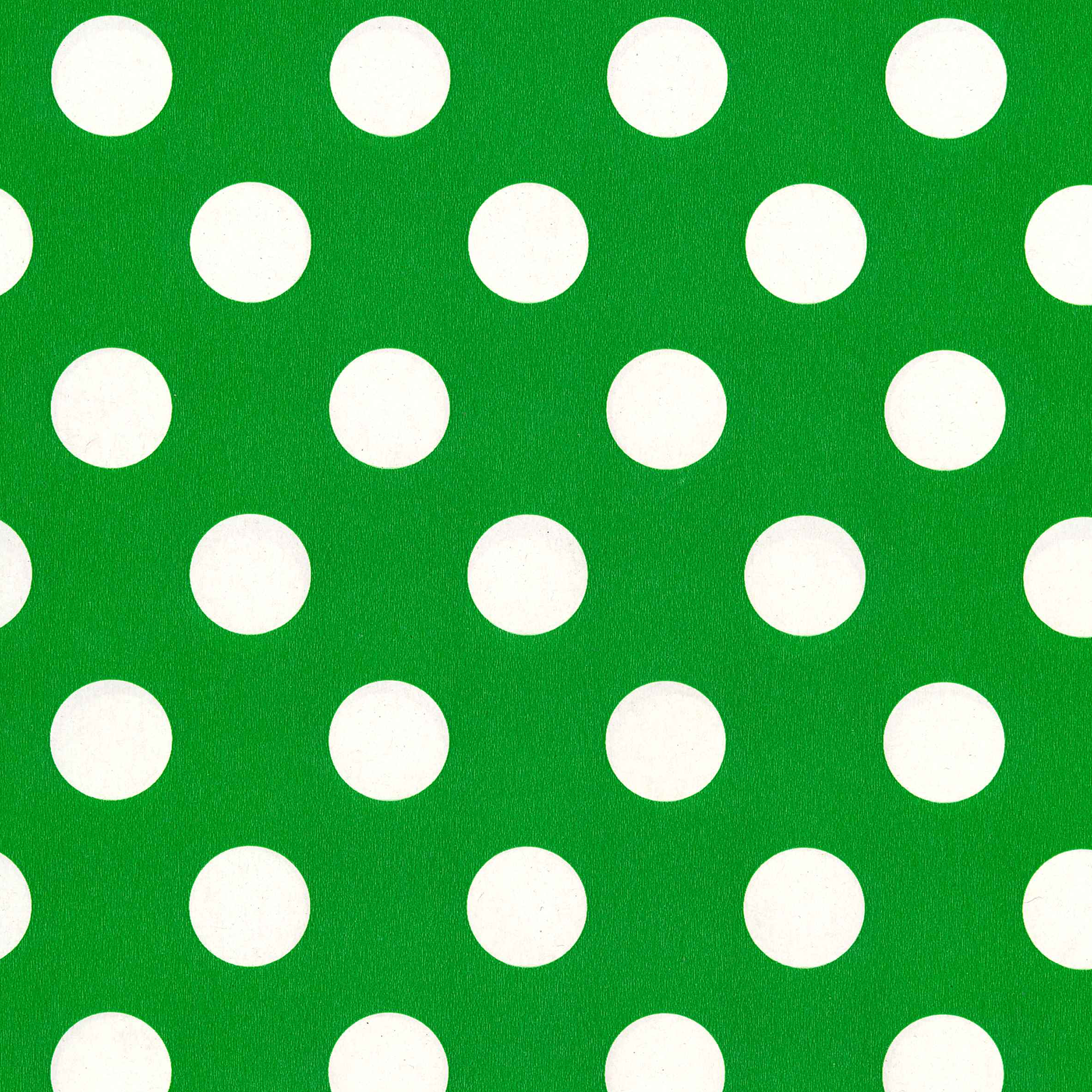 Green background with white polka dots