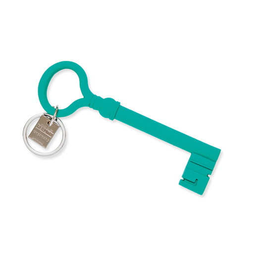 Turquoise key-shaped keychain with a silver ring and tag on a white background