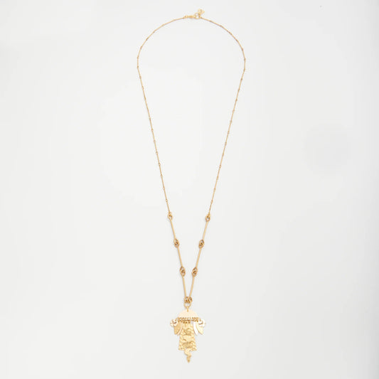 Gold necklace with a pendant on a light gray background