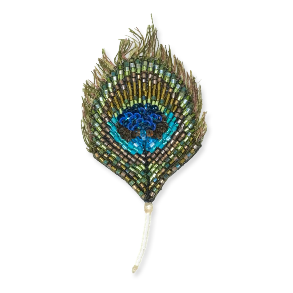 Decorative peacock feather with beads on a white background