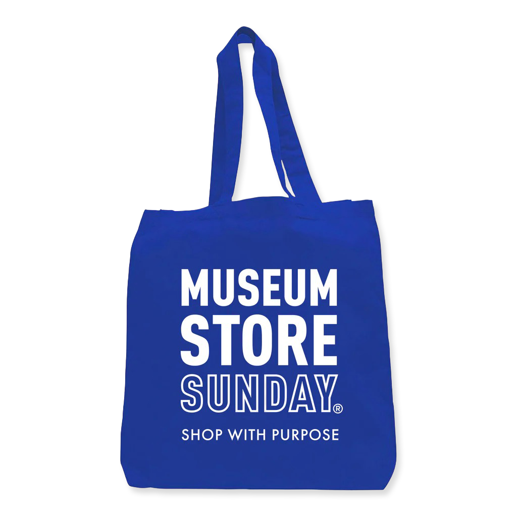 Blue tote bag with 'Museum Store Sunday' text on a white background