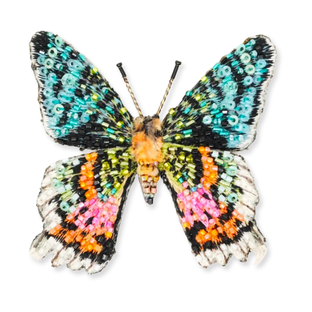 Colorful butterfly with bead-like pattern on a white background