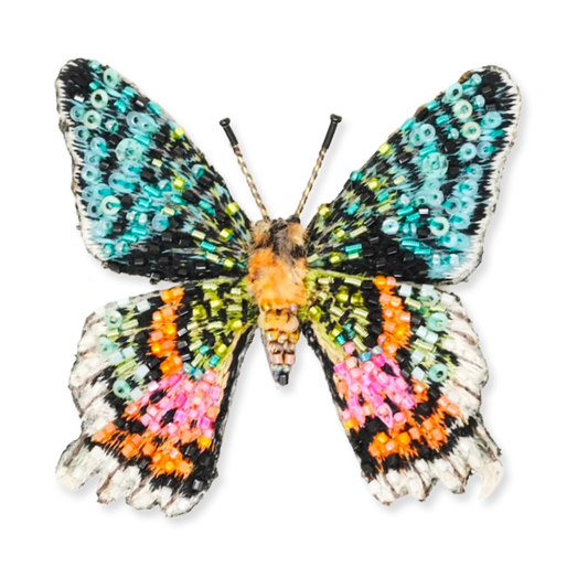 Colorful butterfly with bead-like pattern on a white background