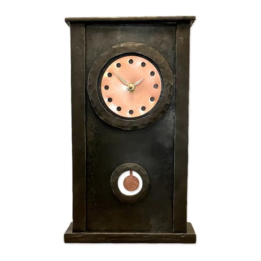 Decorative clock with a metallic finish on a white background