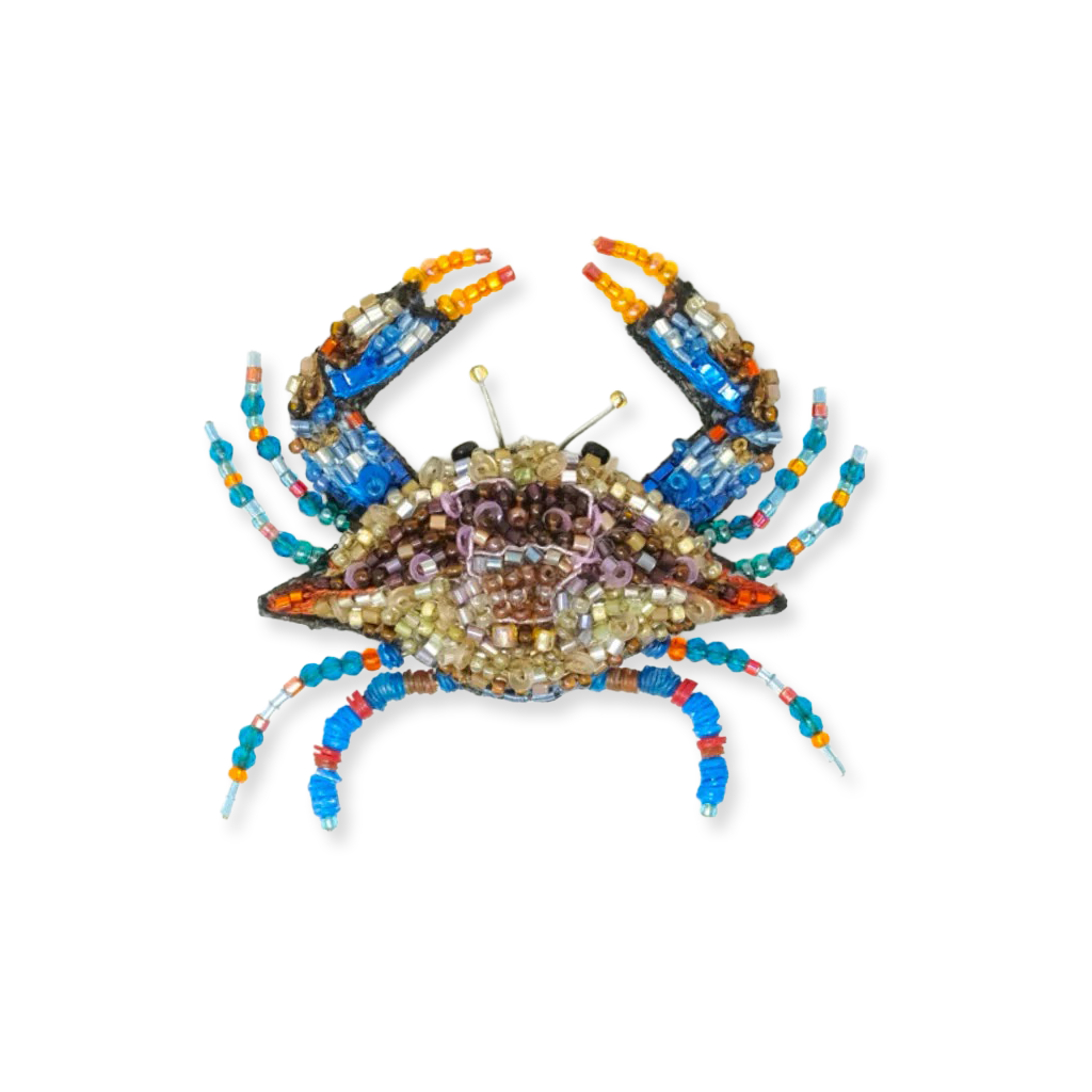 Decorative crab made of beads on a white background