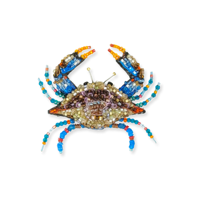 Decorative crab made of beads on a white background