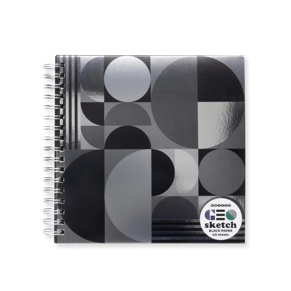 Spiral-bound sketchbook with geometric metallic black and gray circle pattern on a white background