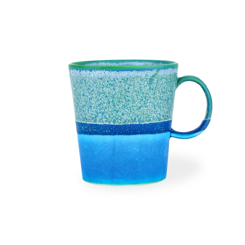 Blue ceramic mug with a speckled pattern on a white background