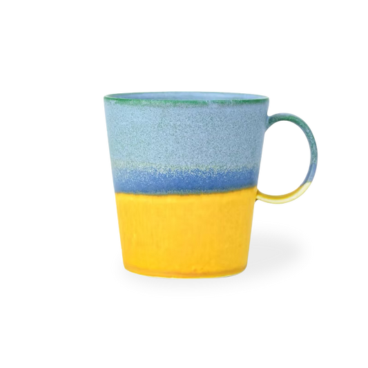 Colorful mug with blue and yellow gradient on a white background