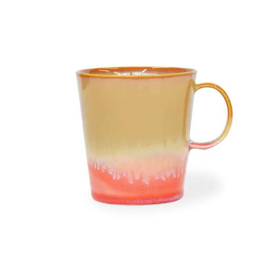 Mug with gradient color from yellow to red on a white background