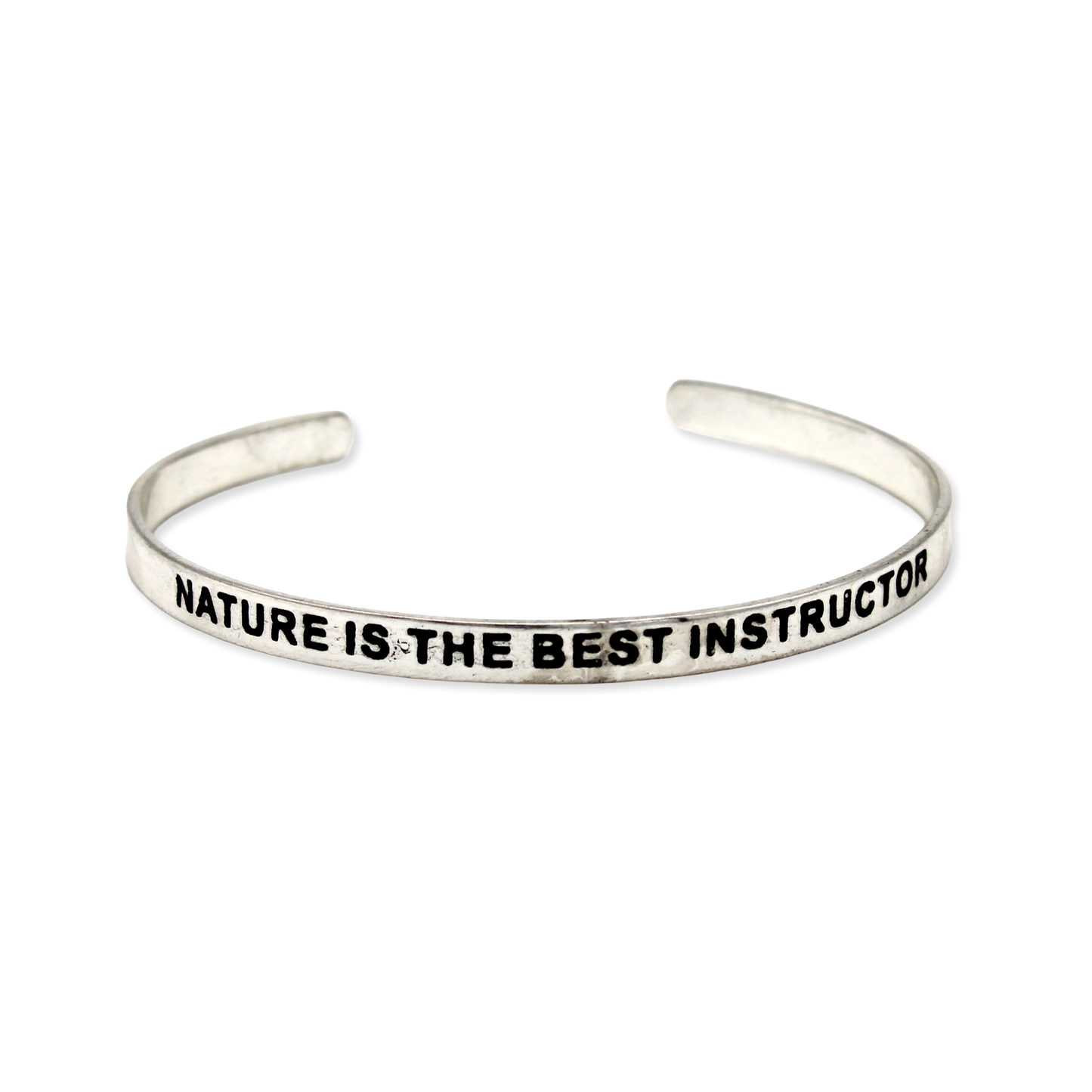 Silver cuff with the motto "Nature is the best instructor"