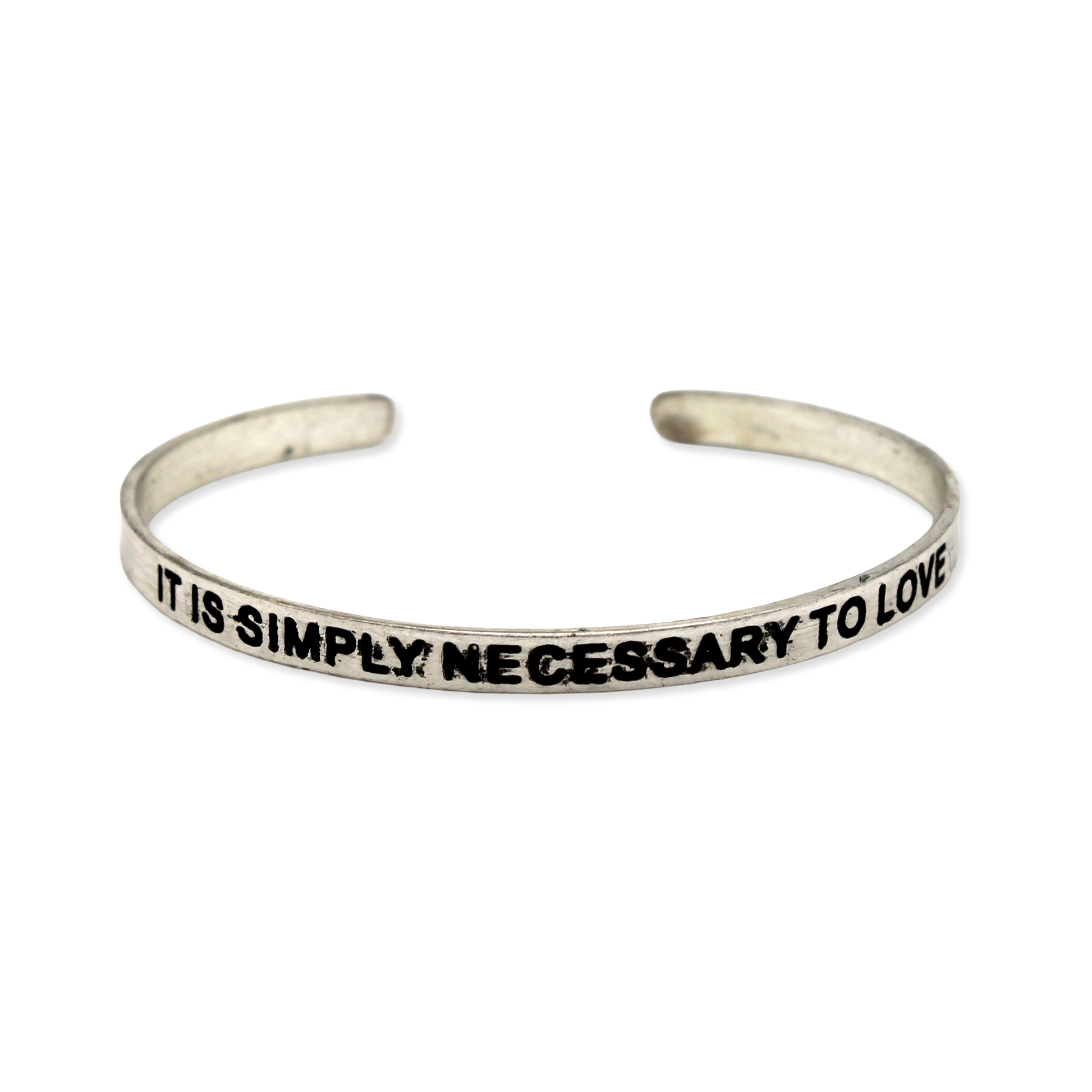 Silver cuff with the motto "It is simply necessary to love"