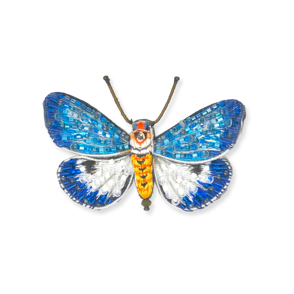 Butterfly-shaped decorative item with blue, orange, and silver colors on a white background