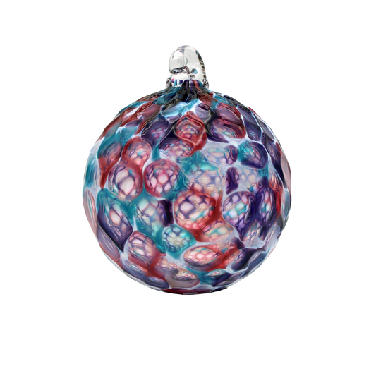 Multicolored glass ornament on a white background