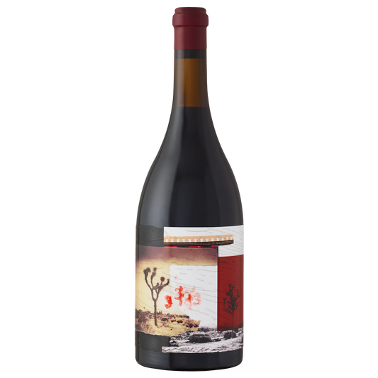 Wine bottle with a label featuring a desert landscape and cactus on a white background