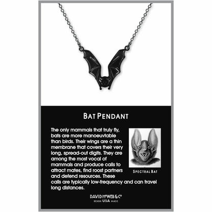 Black bat pendant necklace on a card with information about bats
