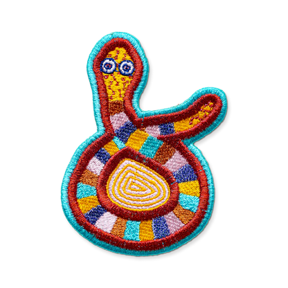 Colorful embroidered patch with abstract design on a white background